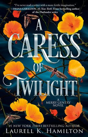 A Caress of Twilight Paperback by Laurell K. Hamilton