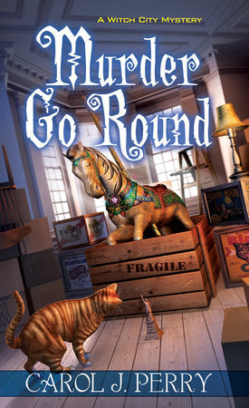 Murder Go Round Paperback by Carol J. Perry
