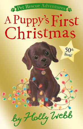 A Puppy's First Christmas Paperback by Holly Webb; illustrated by Sophy Williams