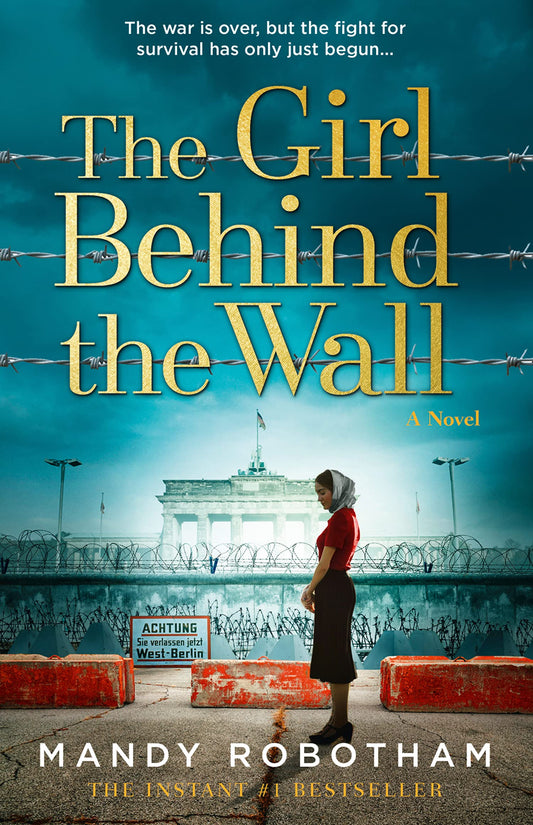 The Girl Behind the Wall: A novel Paperback by Mandy Robotham
